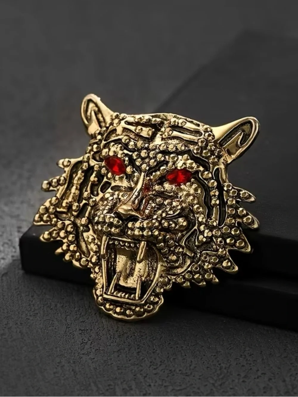 gold-tone metal roaring tiger head brooch red rhinestone eyes textured detail